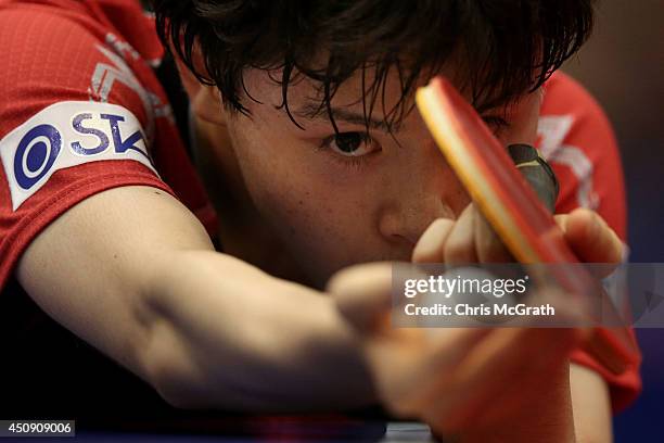 Masataka Morizono of Japan serves against Mattias Karlsson of Sweden during their Men's Singles match on day one of 2014 ITTF World Tour Japan Open...