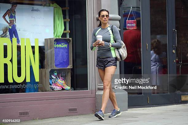 Melanie Sykes is seen taking a walk in Hampsted with a coffee before paying a visit to the gym on June 19, 2014 in London, England.