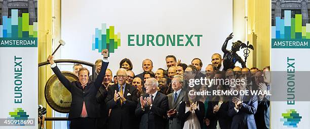 Cees Vermaas, CEO of Euronext Amsterdam reacts with his staff during the IPO of Euronext in Amsterdam on June 20, 2014. Shares in newly floated...