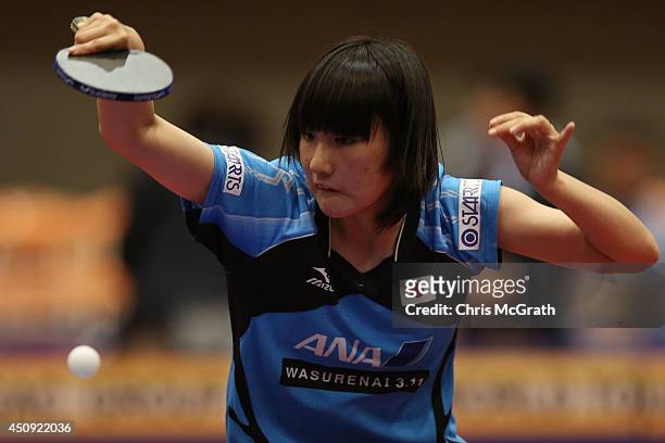 Tashiro Saki of Japan returns a shot against Chen Szu-Yu of Taipei during their Women's Singles match on day one of 2014 ITTF World Tour Japan Open...