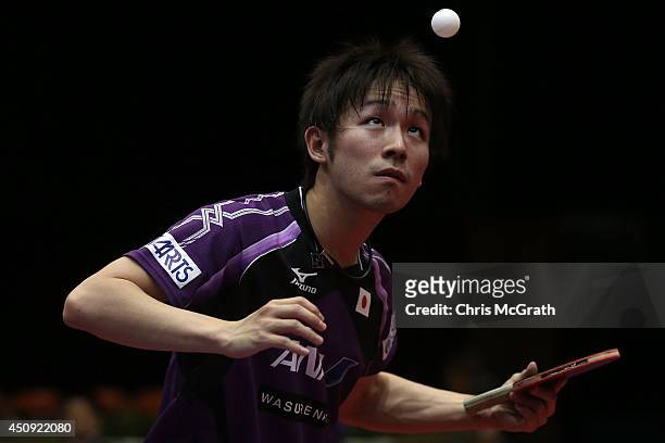 Koki Niwa of Japan serves against Morizono Masataka of Japan during their Men's Singles match on day one of 2014 ITTF World Tour Japan Open at...
