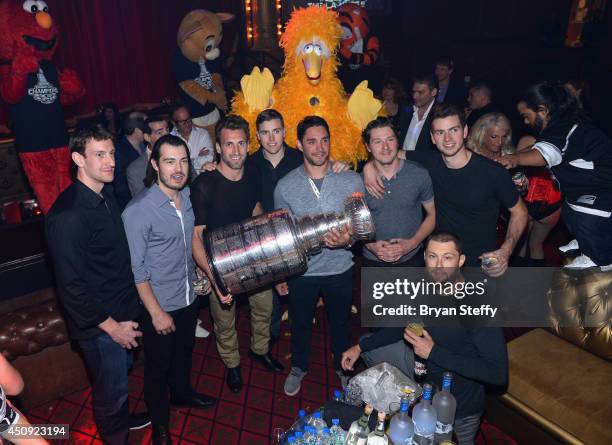 Los Angeles Kings team members Tyler Toffoli, Drew Doughty, Jarret Stoll, Alec Martinez, Brayden McNabb, Martin Jones, and Trevor Lewis appear with...