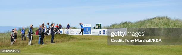 Haydn McCullen of Delamere Forest plays his first shot on the 1st tee during The Amateur Championship 2014 Day Five at Royal Portrush Golf Club on...