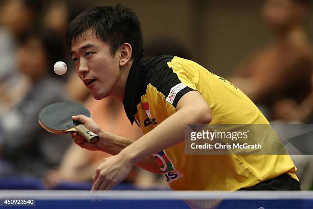 Chen Feng of Singapore serves against Alexandre Robinot of France during their Under 21 Boys Round of 16 match on day one of 2014 ITTF World Tour...