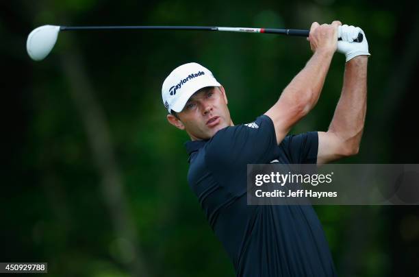 Shawn Stefani of the United States watches his tee shot on the 12th hole during the second round of the Travelers Championship golf tournament at the...