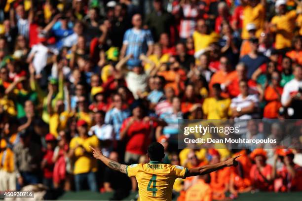 Tim Cahill of Australia celebrates after scoring the team's first goal during the 2014 FIFA World Cup Brazil Group B match between Australia and...