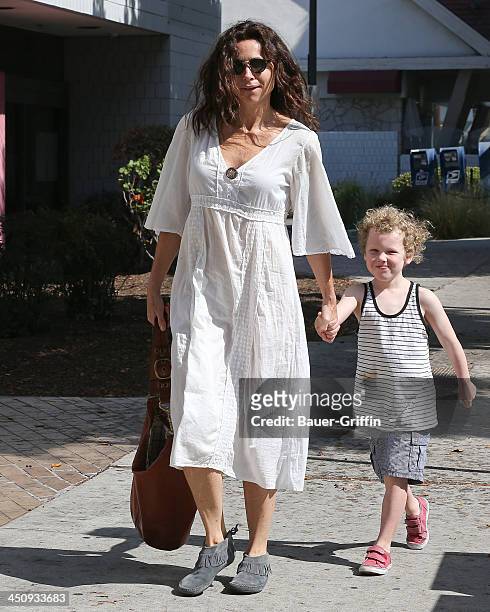August 16: Minnie Driver and her son Henry Story Driver are seen on August 16, 2013 in Los Angeles, California.