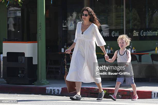 August 16: Minnie Driver and her son Henry Story Driver are seen on August 16, 2013 in Los Angeles, California.