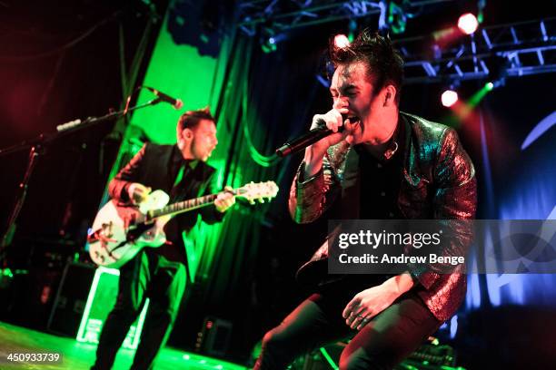 Brendon Urie of Panic! At The Disco performs on stage at Manchester Arena on November 20, 2013 in Manchester, United Kingdom.