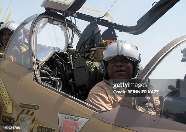 This photo taken on June 18, 2014 in Garoua, northern Cameroon, shows a Cameroonian Air Force pilot in sitting in an Alpha Jet after returning from a...