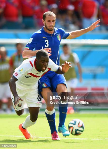 Joel Campbell of Costa Rica falls after a challenge by Giorgio Chiellini of Italy during the 2014 FIFA World Cup Brazil Group D match between Italy...