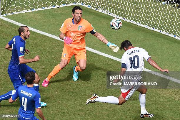 Costa Rica's forward Bryan Ruiz heads the ball to score as Italy's goalkeeper Gianluigi Buffon looks on during a Group D football match between Italy...