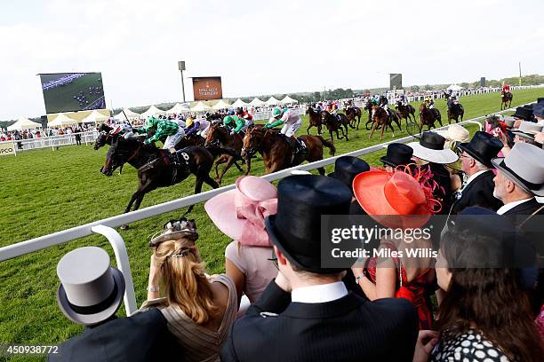 General view of racegoers watching the riders during day four of Royal Ascot 2014 at Ascot Racecourse on June 20, 2014 in Ascot, England.