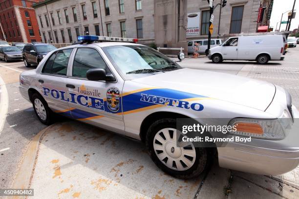 Louisville Metro Police car sits outside KFC Yum Center, home of the Louisville Cardinals basketball team on May 30, 2014 in Louisville, Kentucky.