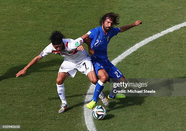 Christian Bolanos of Costa Rica and Andrea Pirlo of Italy compete for the ball during the 2014 FIFA World Cup Brazil Group D match between Italy and...