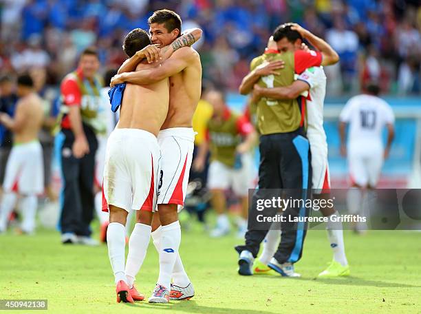 Cristian Gamboa and Oscar Granados of Costa Rica hug in celebration after defeating Italy 1-0 during the 2014 FIFA World Cup Brazil Group D match...