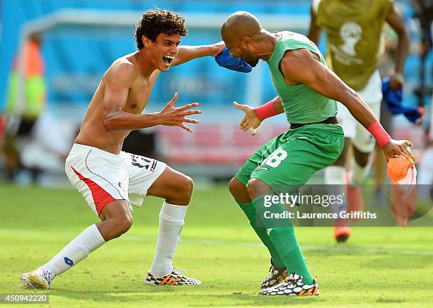 Yeltsin Tejeda of Costa Rica celebrates with teammate Patrick Pemberton after defeating Italy 1-0 during the 2014 FIFA World Cup Brazil Group D match...