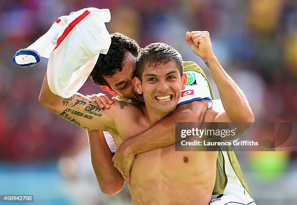 Cristian Gamboa of Costa Rica celebrates with Michael Barrantes after defeating Italy 1-0 during the 2014 FIFA World Cup Brazil Group D match between...