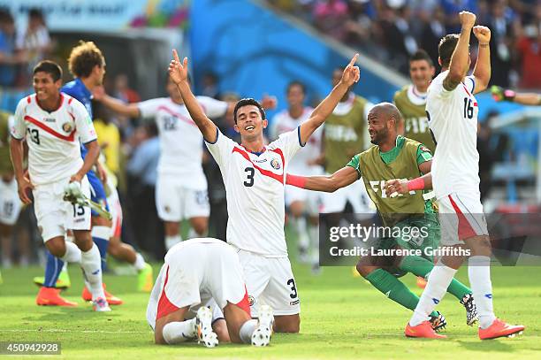 Giancarlo Gonzalez of Costa Rica celebrates with teammates after defeating Costa Rica 1-0 during the 2014 FIFA World Cup Brazil Group D match between...