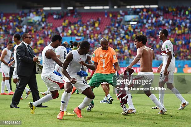 Costa Rica players dance and celebrate a 1-0 victory over Italy in the 2014 FIFA World Cup Brazil Group D match between Italy and Costa Rica at Arena...