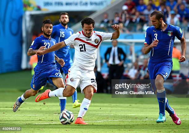 Marco Urena of Costa Rica controls the ball as Giorgio Chiellini of Italy looks on during the 2014 FIFA World Cup Brazil Group D match between Italy...