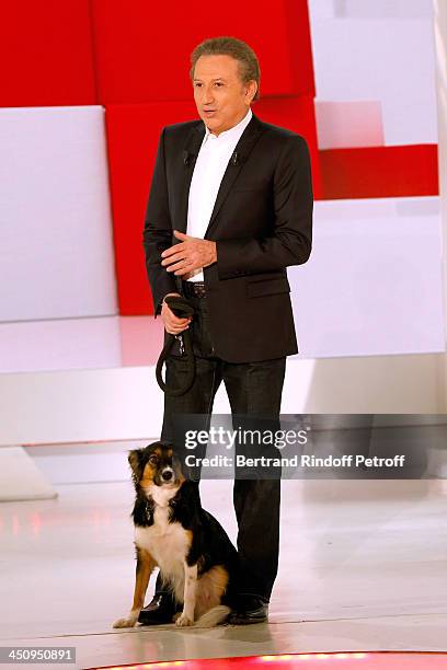 Presenter of the show Michel Drucker and his dog attend the 'Vivement Dimanche' French TV Show, held at Pavillon Gabriel on November 20, 2013 in...