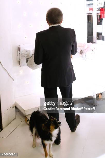 Presenter of the show Michel Drucker and his dog attend the 'Vivement Dimanche' French TV Show, held at Pavillon Gabriel on November 20, 2013 in...