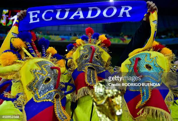 Ecuador supporters in costumes bearung the colours of their national flag cheer as they await the kick-off of a Group E football match between...