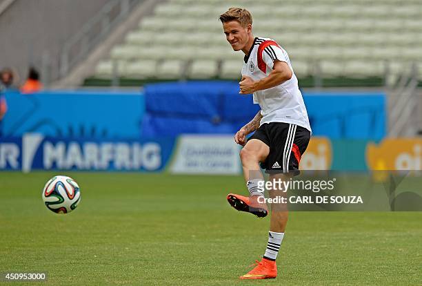 Germany's defender Erik Durm kicks the ball during a training session at the Castelao stadium in Fortaleza on June 18, 2014. Germany will face Ghana...