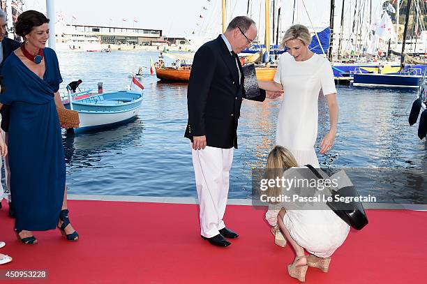 Princess Caroline of Hanover, Prince Albert II of Monaco and Princess Charlene of Monaco attend the Monaco Yacht Club Opening on June 20, 2014 in...