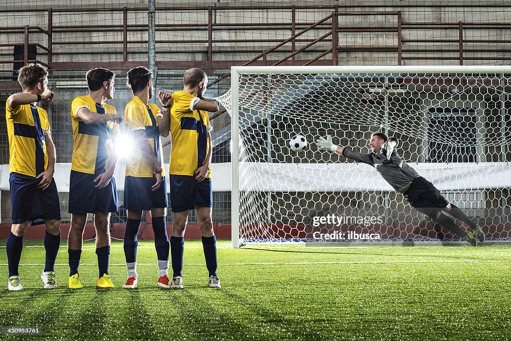 Football match in stadium: Free kick goal