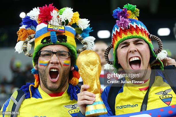 Ecuador fans hold a replica of the World Cup trophy during the 2014 FIFA World Cup Brazil Group E match between Honduras and Ecuador at Arena da...