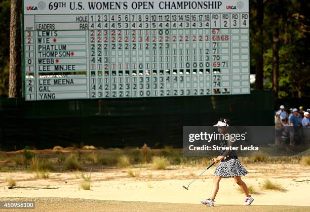 Eleven-year old Amateur Lucy Li of the United States walks up the 18th fairway during the second round of the 69th U.S. Women's Open at Pinehurst...