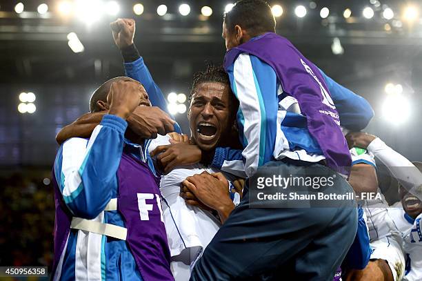 Carlo Costly of Honduras celebrates scoring his team's first goal with his teammates during the 2014 FIFA World Cup Brazil Group E match between...