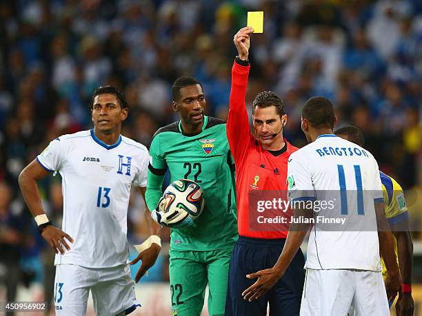 Jerry Bengtson of Honduras is shown a yellow card by referee Benjamin Williams during the 2014 FIFA World Cup Brazil Group E match between Honduras...