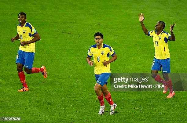 Enner Valencia of Ecuador celebrates scoring his team's first goal with his teammate Oswaldo Minda and Christian Noboa of Ecuador during the 2014...