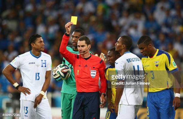 Jerry Bengtson of Honduras is shown a yellow card by referee Benjamin Williams during the 2014 FIFA World Cup Brazil Group E match between Honduras...