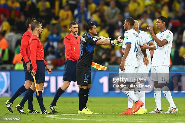 Jerry Bengtson of Honduras and teammates appeal to referee Benjamin Williams at the half during the 2014 FIFA World Cup Brazil Group E match between...