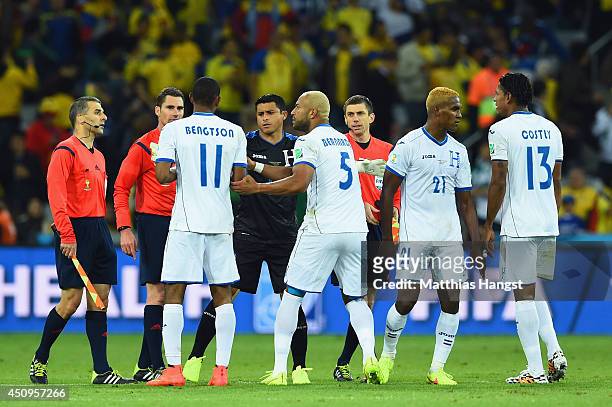 Jerry Bengtson of Honduras and teammates appeal to referee Benjamin Williams at the half during the 2014 FIFA World Cup Brazil Group E match between...