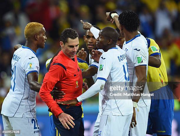 Brayan Beckeles , Oscar Boniek Garcia and Carlo Costly of Honduras appeal to referee Benjamin Williams during the 2014 FIFA World Cup Brazil Group E...