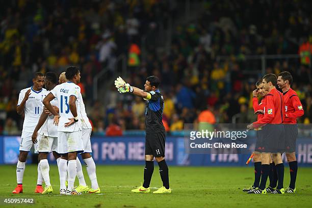 Referee Benjamin Williams and assistant referees look on as Honduras appeal a call at the half during the 2014 FIFA World Cup Brazil Group E match...