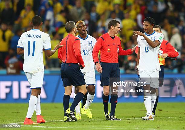 Jerry Bengtson , Brayan Beckeles and Roger Espinoza of Honduras appeal a call with referee Benjamin Williams at the half during the 2014 FIFA World...