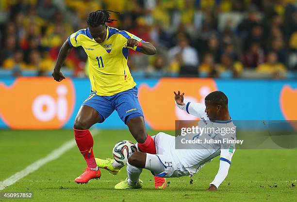 Juan Carlos Garcia of Honduras tackles Felipe Caicedo of Ecuador during the 2014 FIFA World Cup Brazil Group E match between Honduras and Ecuador at...