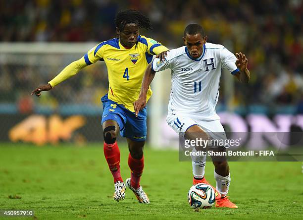 Jerry Bengtson of Honduras and Juan Carlos Paredes of Ecuador compete for the ball during the 2014 FIFA World Cup Brazil Group E match between...