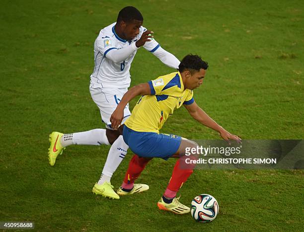 Honduras' defender Juan Carlos Garcia vies with Ecuador's forward Jefferson Montero during a Group E football match between Honduras and Ecuador at...
