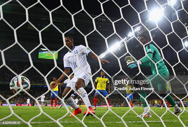 Jerry Bengtson of Honduras scores past Alexander Dominguez of Ecuador but the goal was disallowed during the 2014 FIFA World Cup Brazil Group E match...