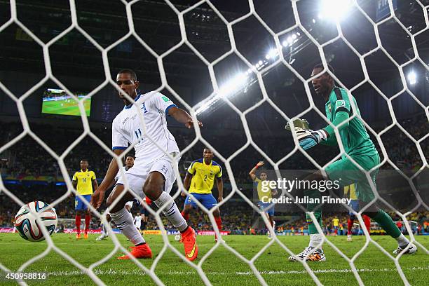 Jerry Bengtson of Honduras scores past Alexander Dominguez of Ecuador but the goal was disallowed during the 2014 FIFA World Cup Brazil Group E match...