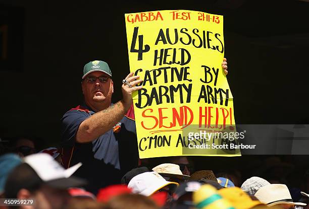 Man holds a Barmy Army sign aloft during day one of the First Ashes Test match between Australia and England at The Gabba on November 21, 2013 in...
