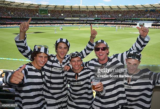 Barmy Army members dressed as convicts pose during day one of the First Ashes Test match between Australia and England at The Gabba on November 21,...