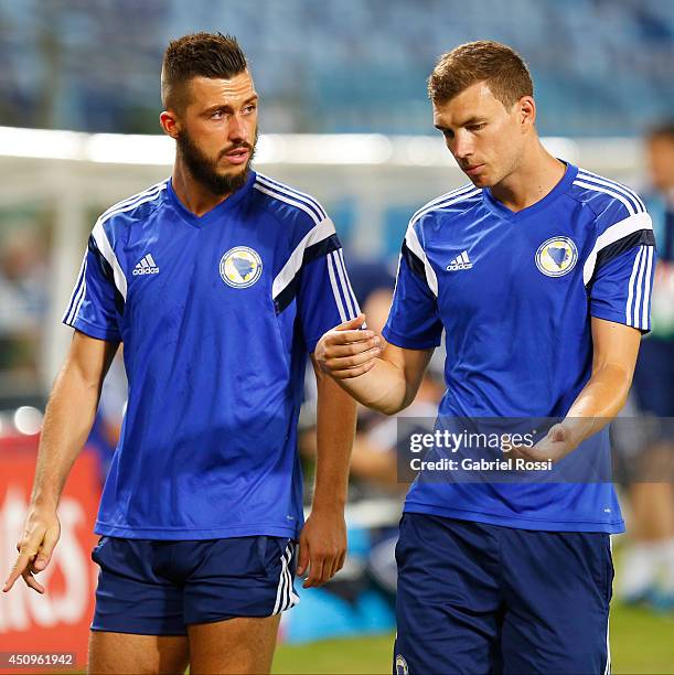 Edin Dzeko and Haris Medunjanin of Bosnia and Herzegovina national football team talks in a training session during the 2014 FIFA World Cup in...